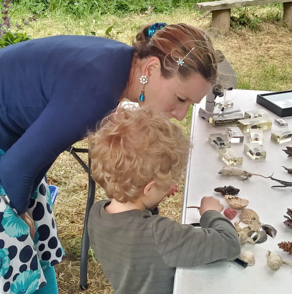 Lizzie teaching achild at Hay festival